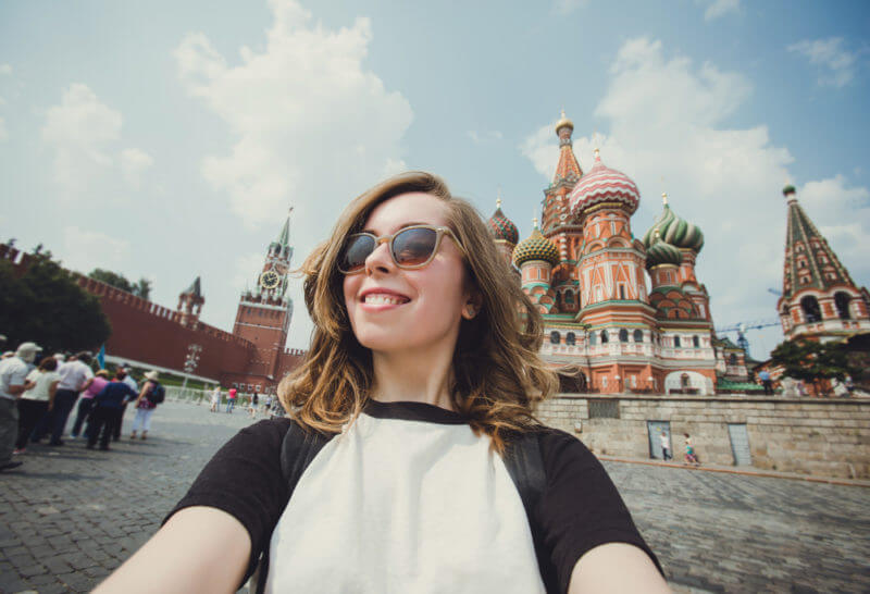 photo of girl in front of cool building